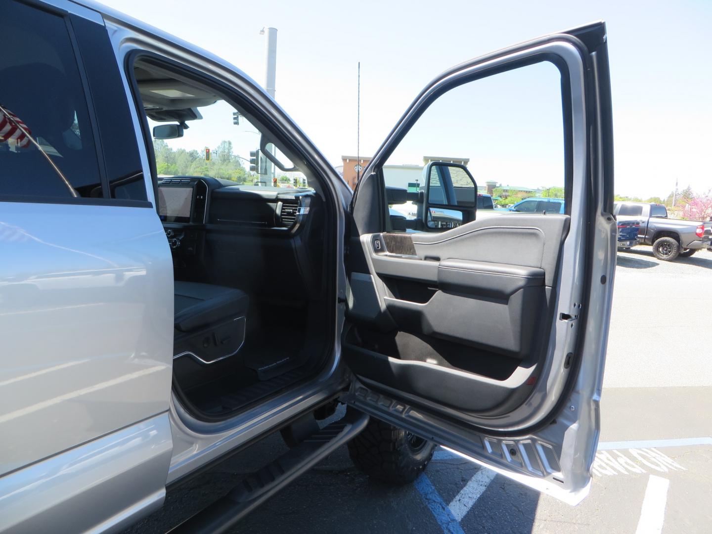 2023 SILVER /BLACK Ford F-350 SD Lariat Crew Cab 4WD (1FT8W3BT2PE) with an 6.7L V8 DIESEL engine, 10 speed automatic transmission, located at 2630 Grass Valley Highway, Auburn, CA, 95603, (530) 508-5100, 38.937893, -121.095482 - Features a BDS 5" radius arm suspension system, Fox Shocks, 37" Nitto Ridge Grappler tires, 20" Fuel Clash wheels, and Camper tie downs. - Photo#51